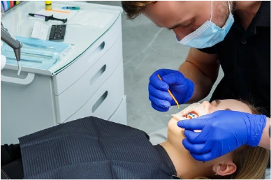 "Applying the whitening gel to the patient’s teeth at Amazing Family Dental, using a safe and effective formula to lift stains.