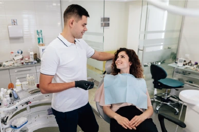 Initial consultation for dental veneers at Amazing Family Dental, where the dentist discusses the patient's goals and evaluates their smile