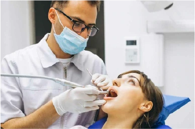 Fitting the permanent dental bridge at Amazing Family Dental, ensuring it aligns properly and meets the patient's aesthetic and functional needs.