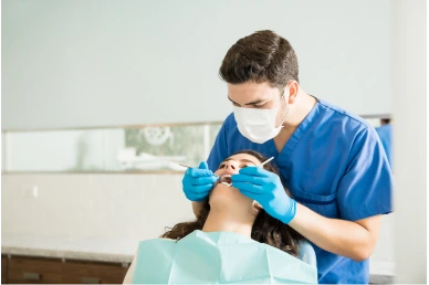 Placing the dental veneers on the patient at Amazing Family Dental, checking for fit and aesthetics before permanently bonding them.