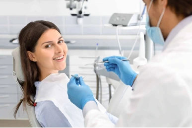 Initial consultation for bruxism appliances at Amazing Family Dental, where a dentist evaluates the patient's symptoms and discusses treatment options.