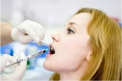 Administering anesthesia before the root canal procedure at Amazing Family Dental, ensuring the patient is comfortable and pain-free during treatment.