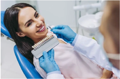 Initial consultation for teeth whitening at Amazing Family Dental, where the dentist assesses the patient’s teeth and discusses whitening options.